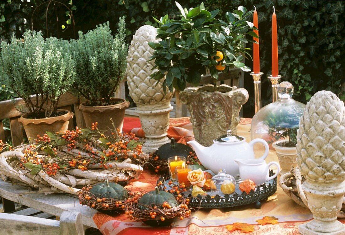 A laid table with an autumnal feel in the open air