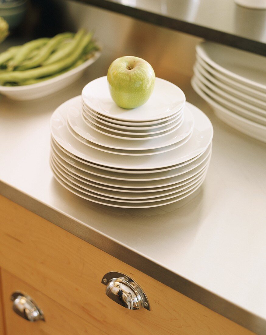 Apple on stack of plates