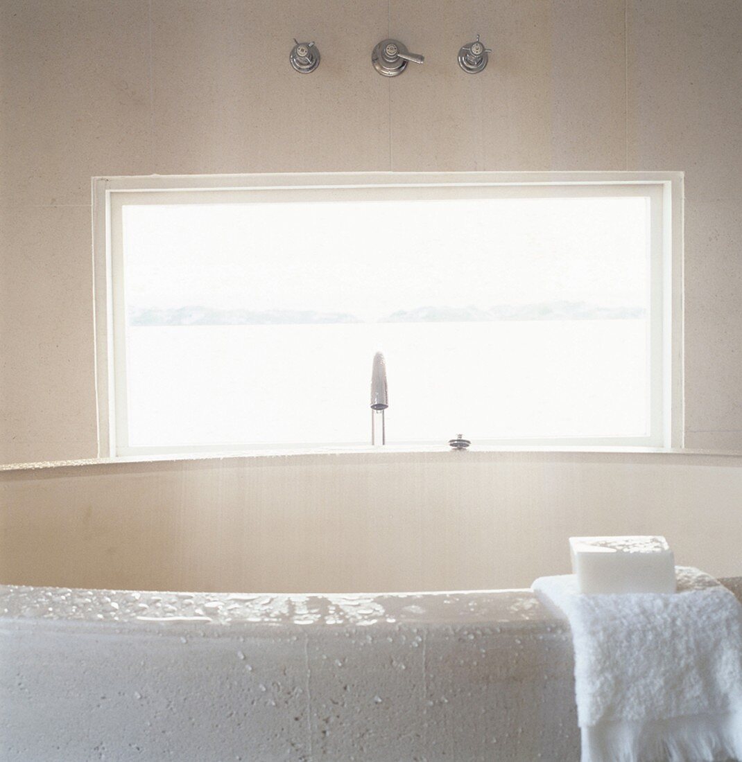 A bath with a view out of a window