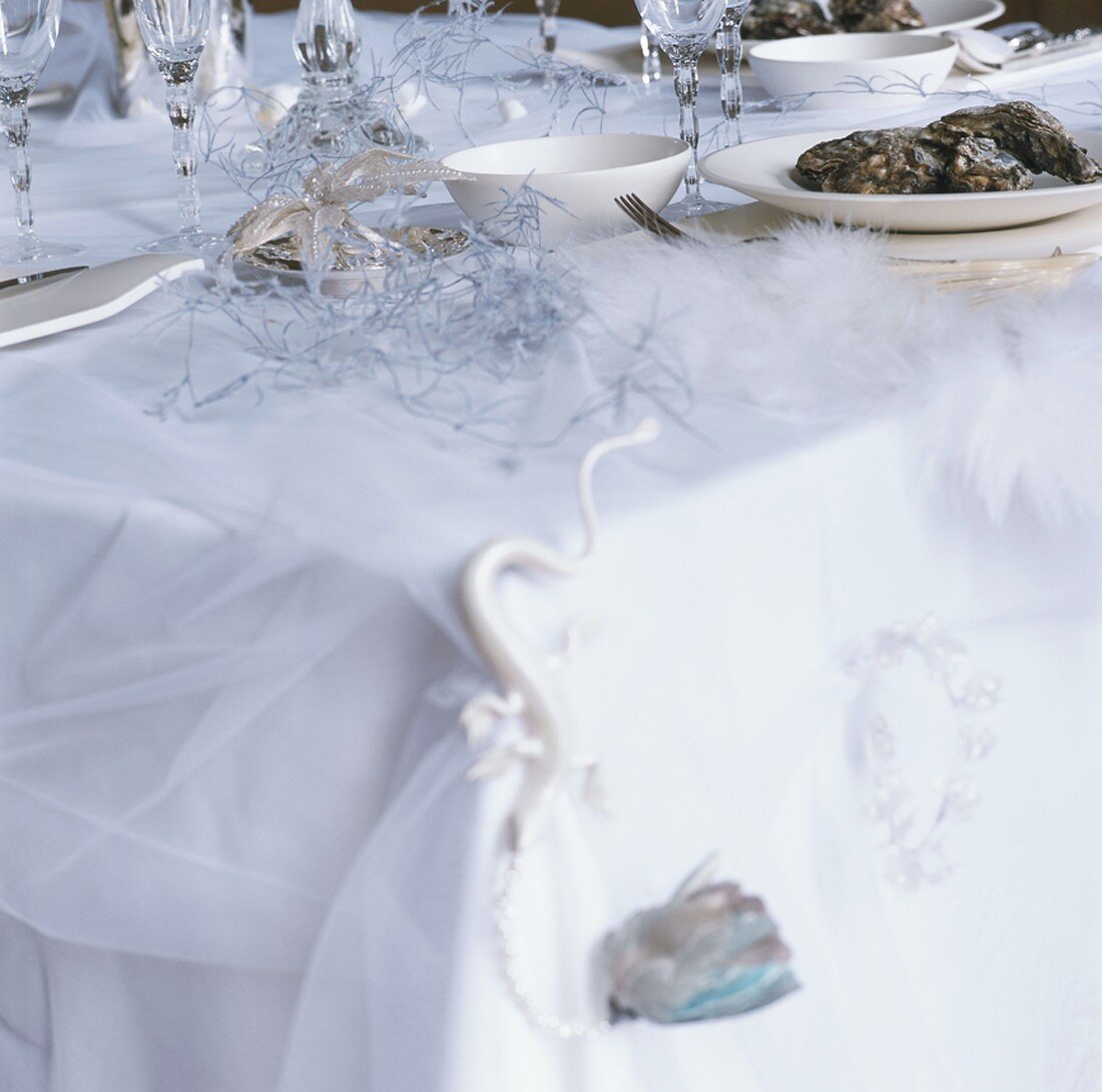 A table with Christmas decorations and oysters