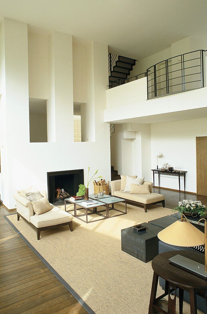 Spacious, modern living room with fireplace and gallery