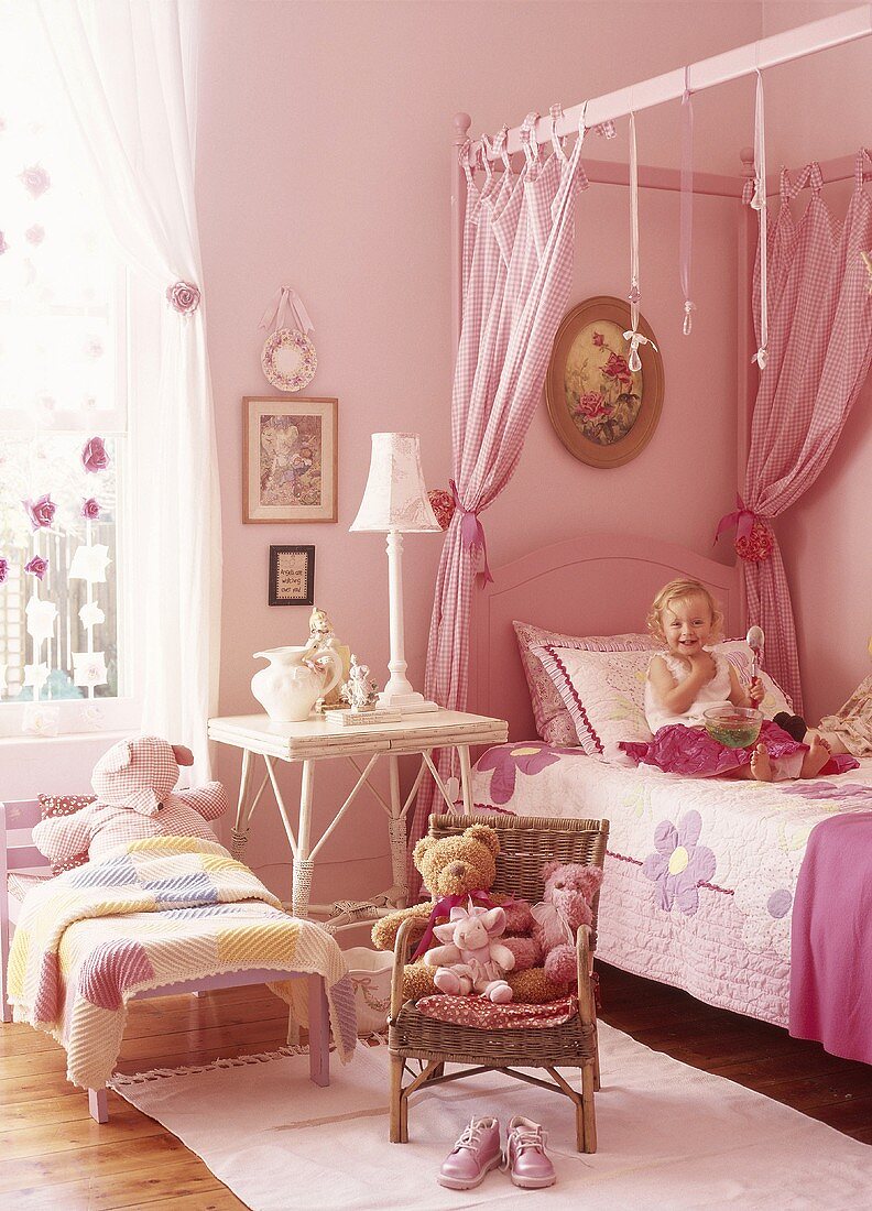 Little girl on child's bed