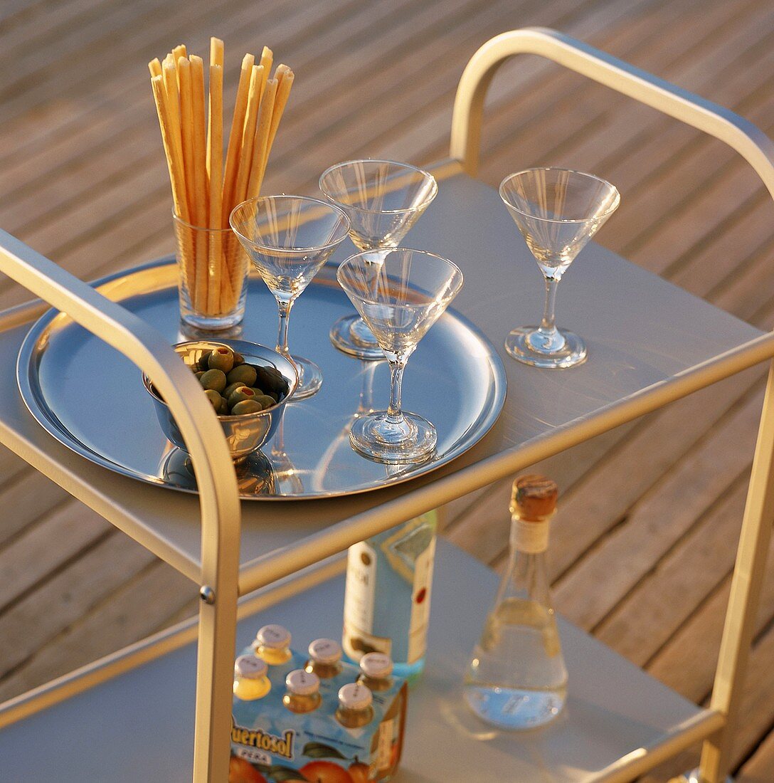 Martini glasses and snack on a serving wagon