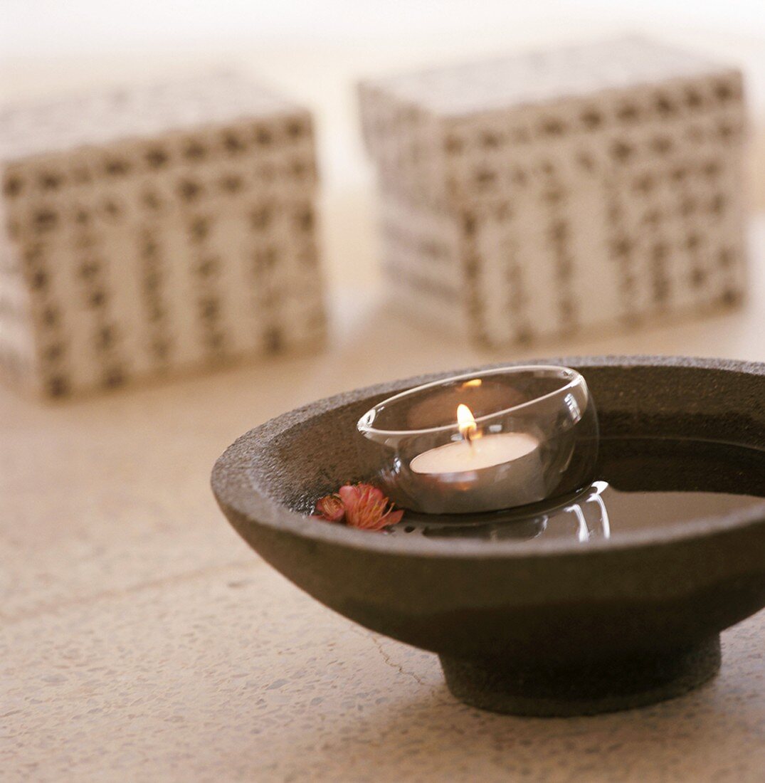 Floating candle in stone bowl