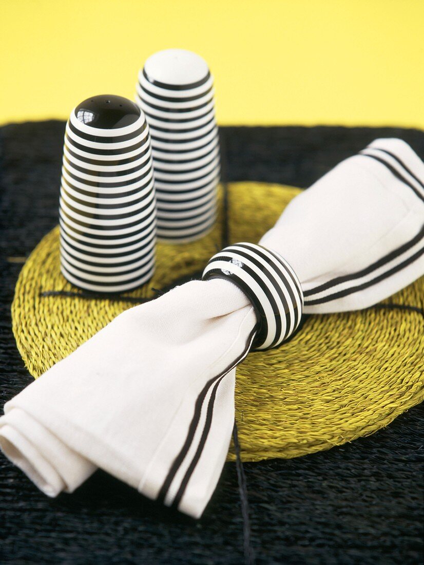 Black and white striped napkin and salt and pepper pots