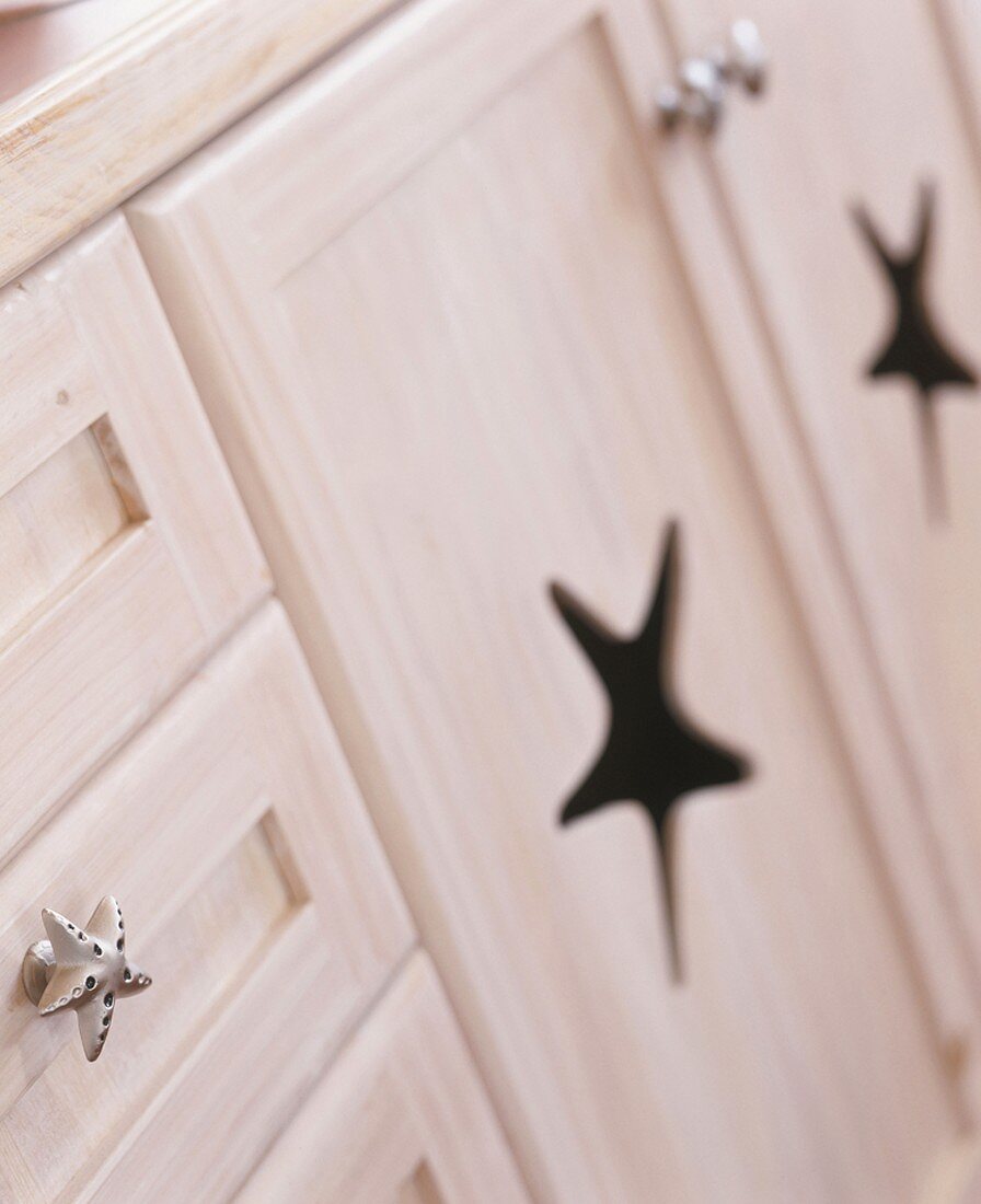 Cabinet doors with star-shaped cut-outs
