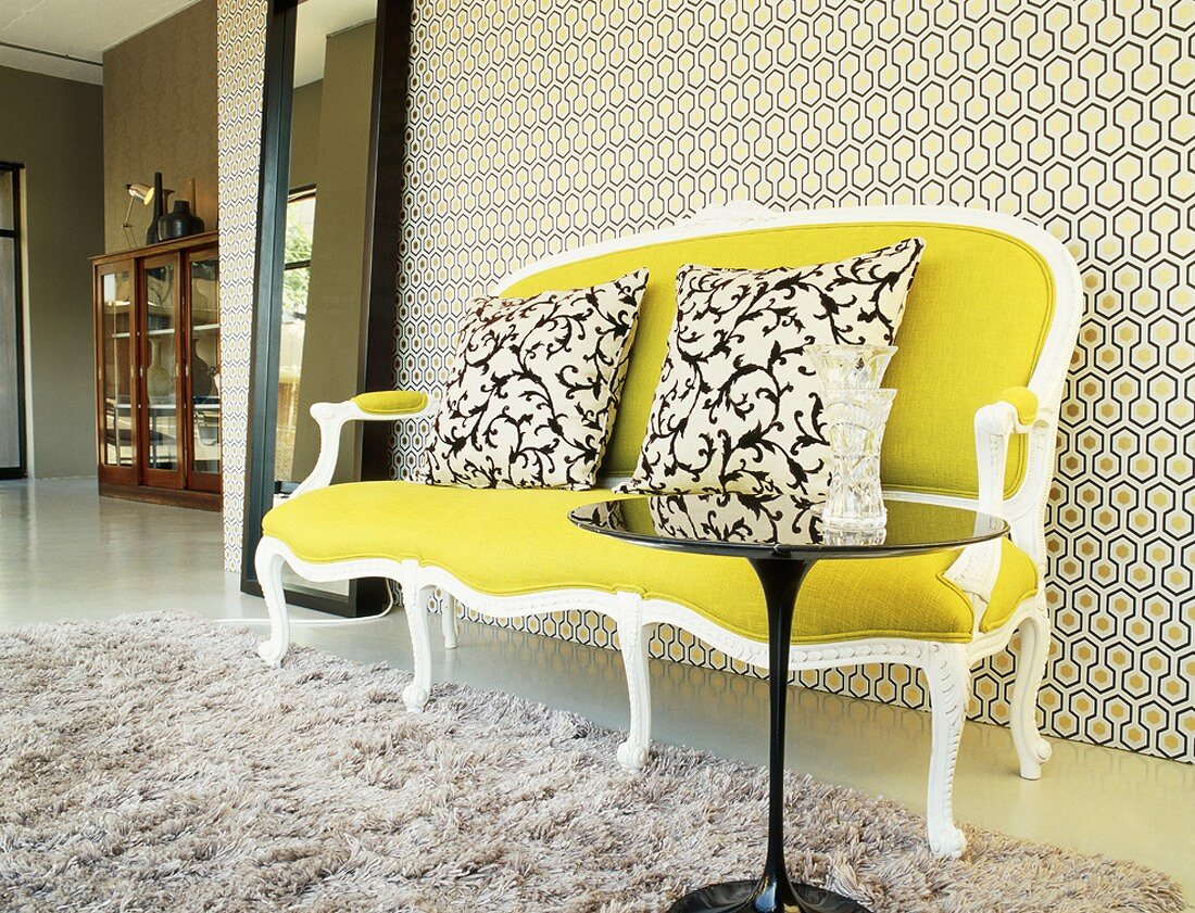 Couch against patterned wallpaper