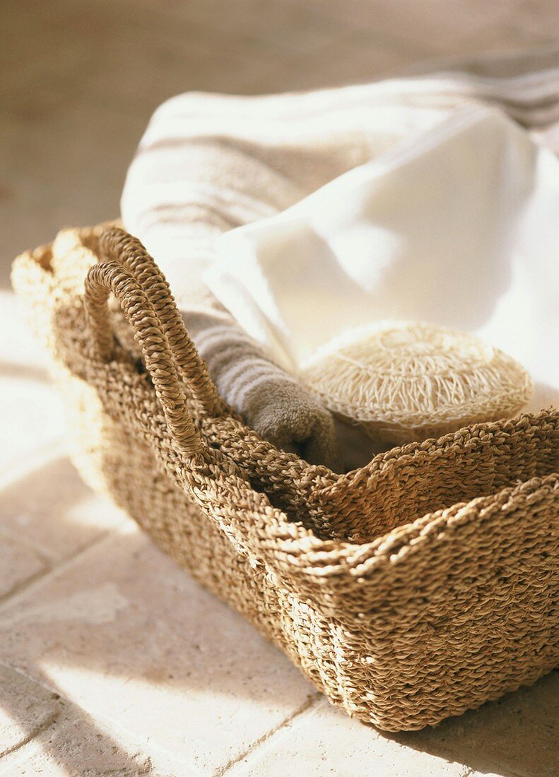 Towels and sponge in basket