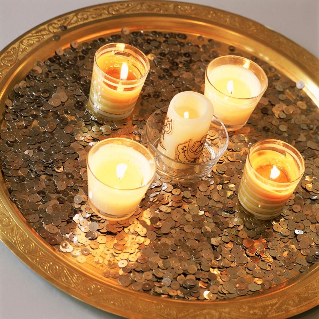 Lit candles on tray