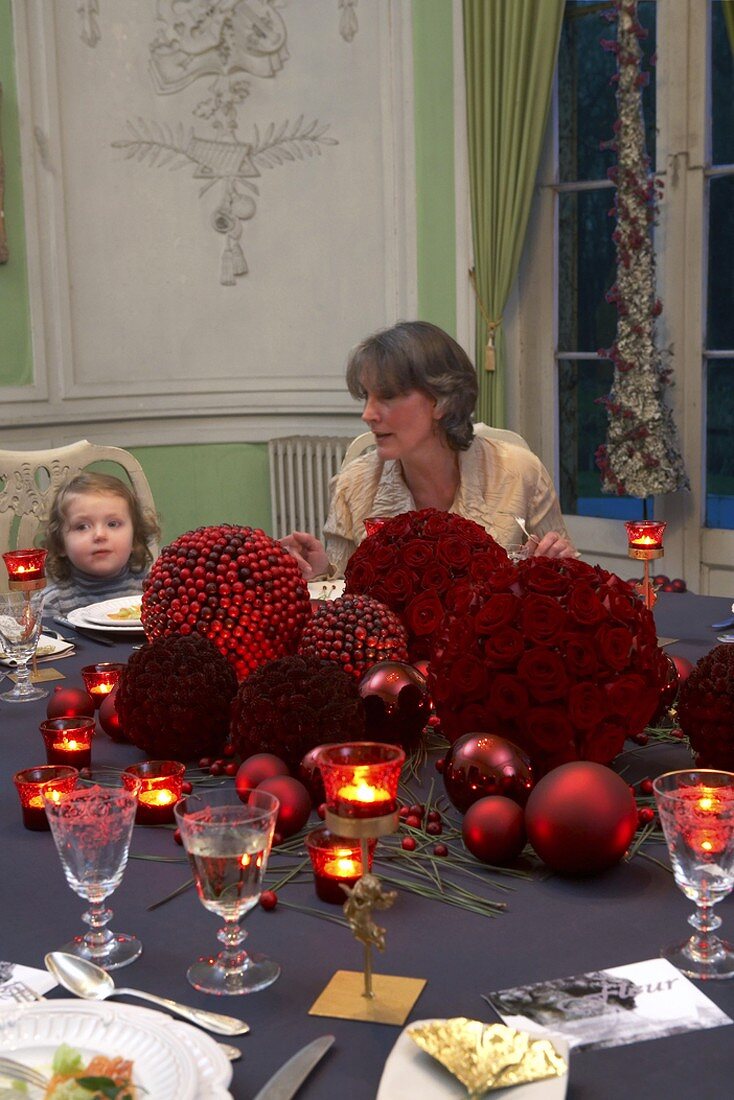 A mother and child at a festively laid table