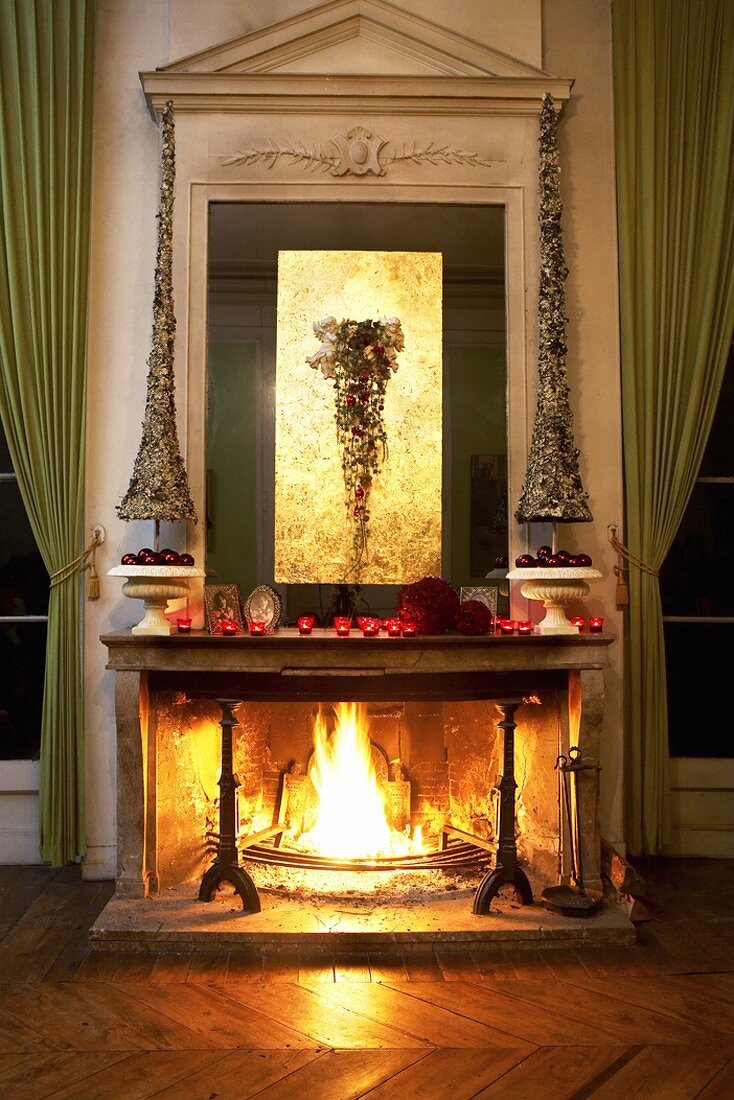 An open fireplace decorated for Christmas