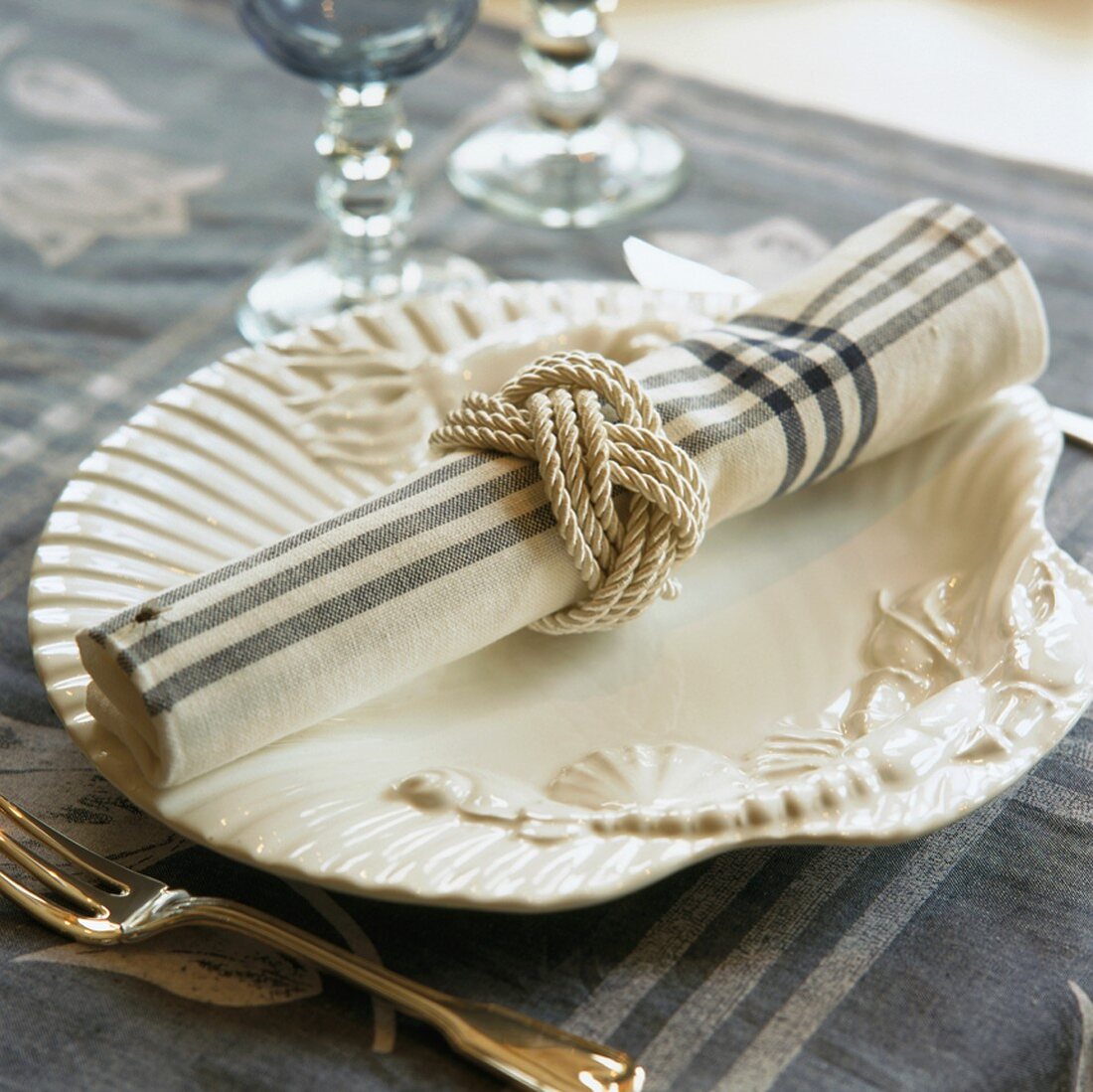 A place setting with a fabric napkin