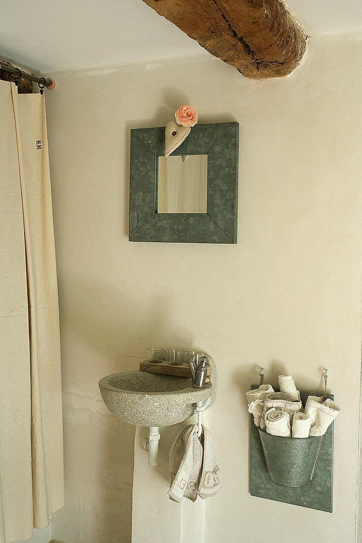 A bathroom with a stone wash basin