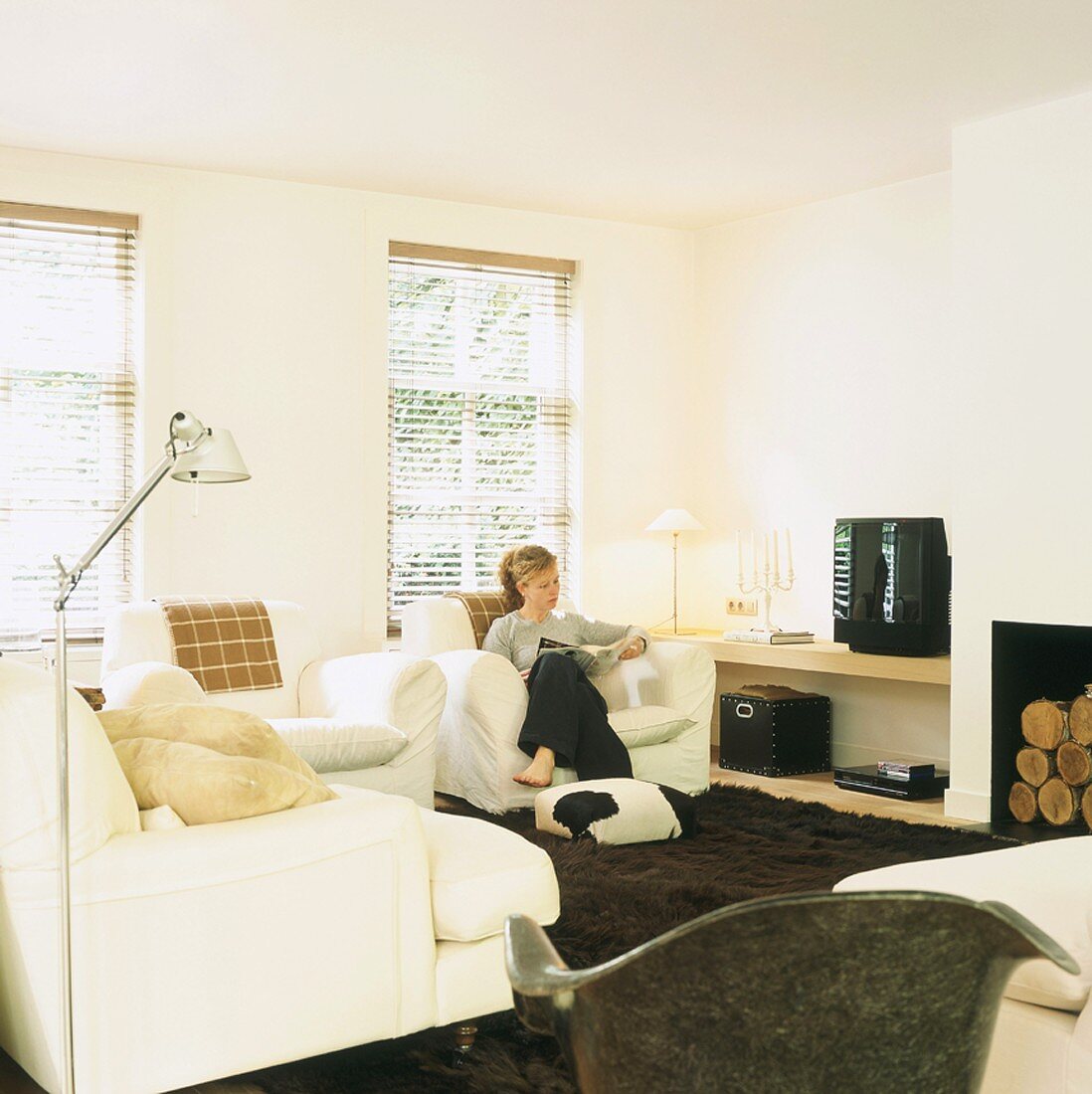 Woman reading magazine in living room