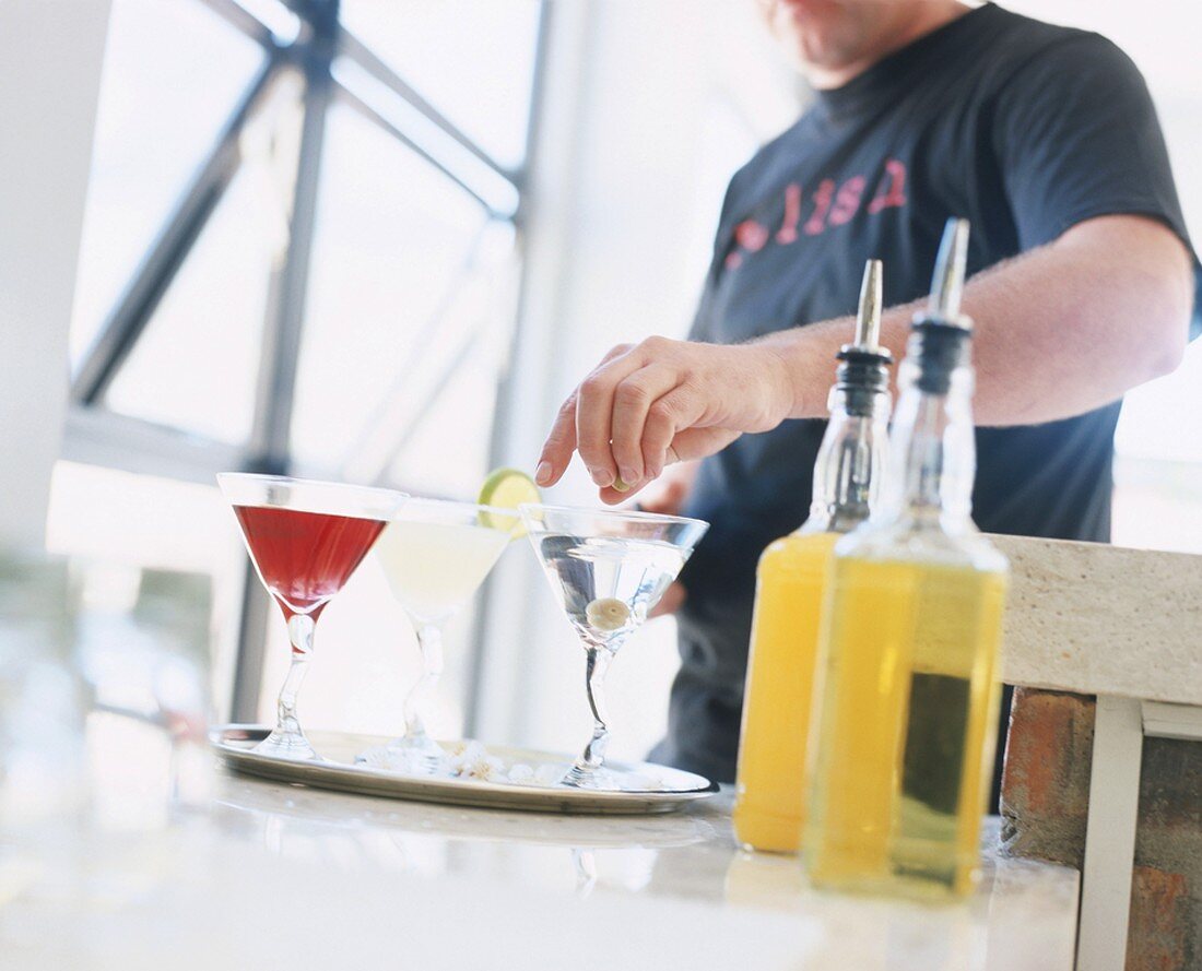 A man mixing Martini cocktails