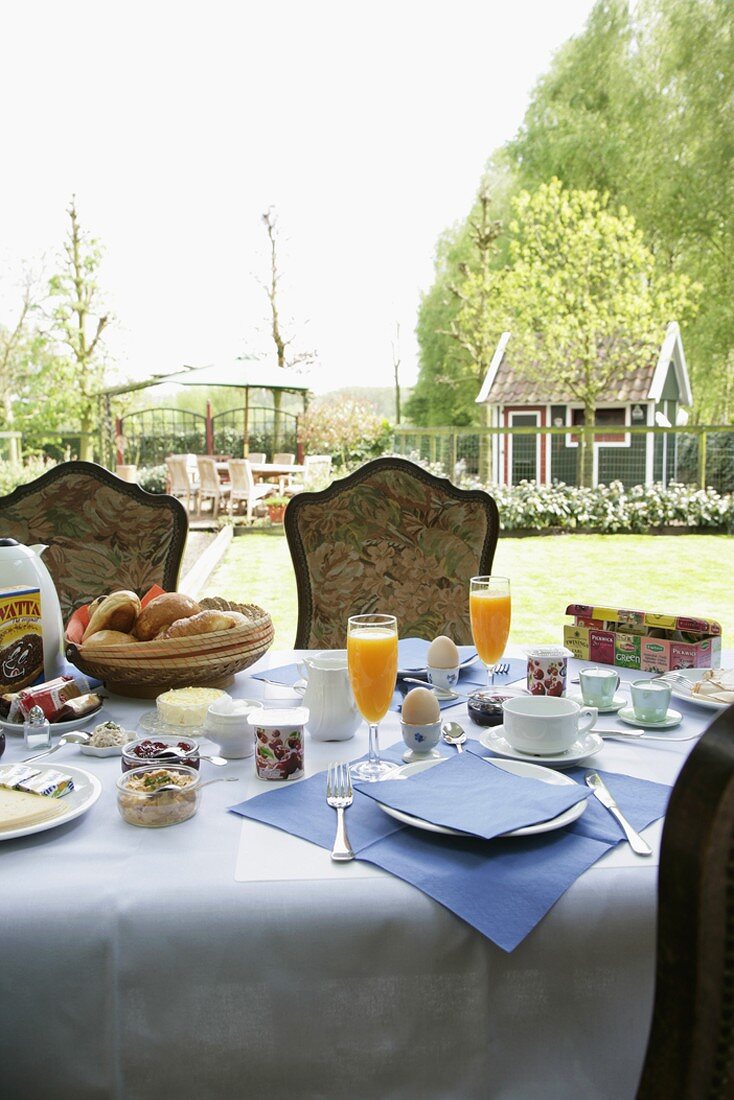 A laid table on a terrace