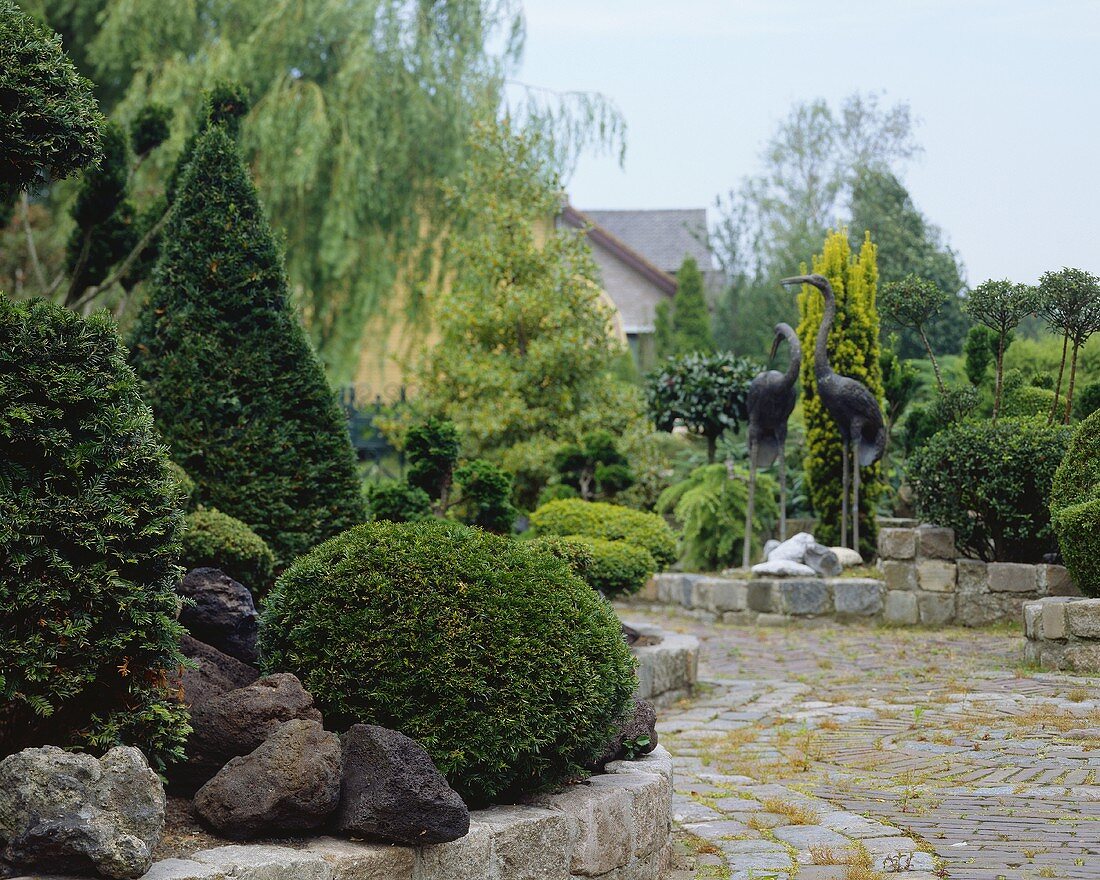 Ornamental garden with box hedges and sculptures