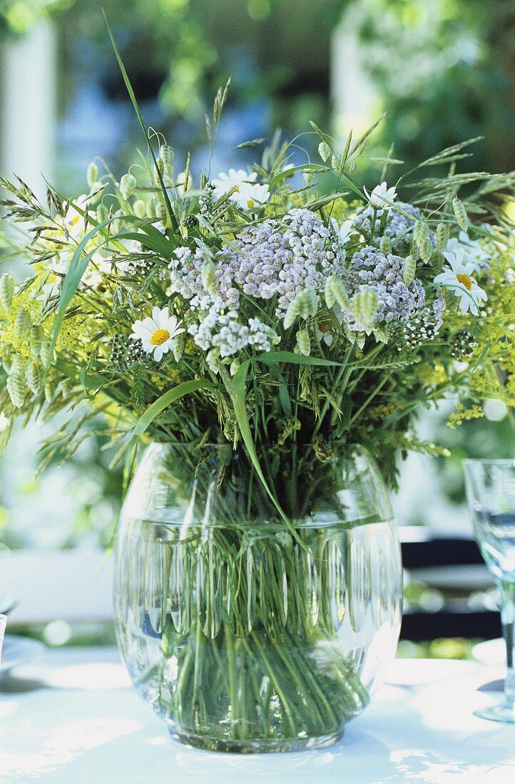 Table decoration of freshly picked flowers and grasses
