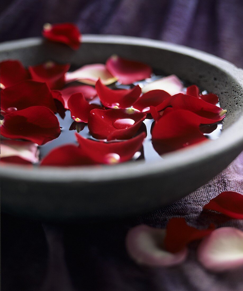 Rose petals in a stone bowl