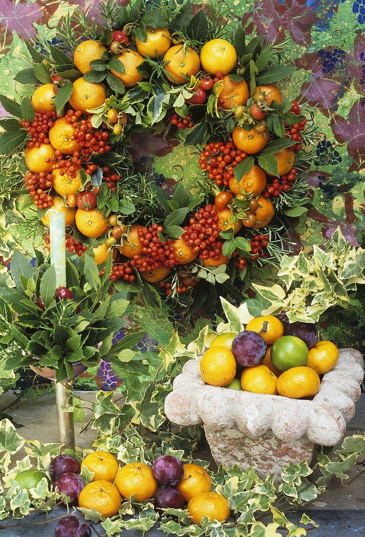 Wreath of oranges, holly, bay leaves & rose hips for Christmas