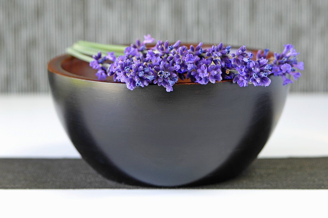 Springs of lavender with flowers on a bowl