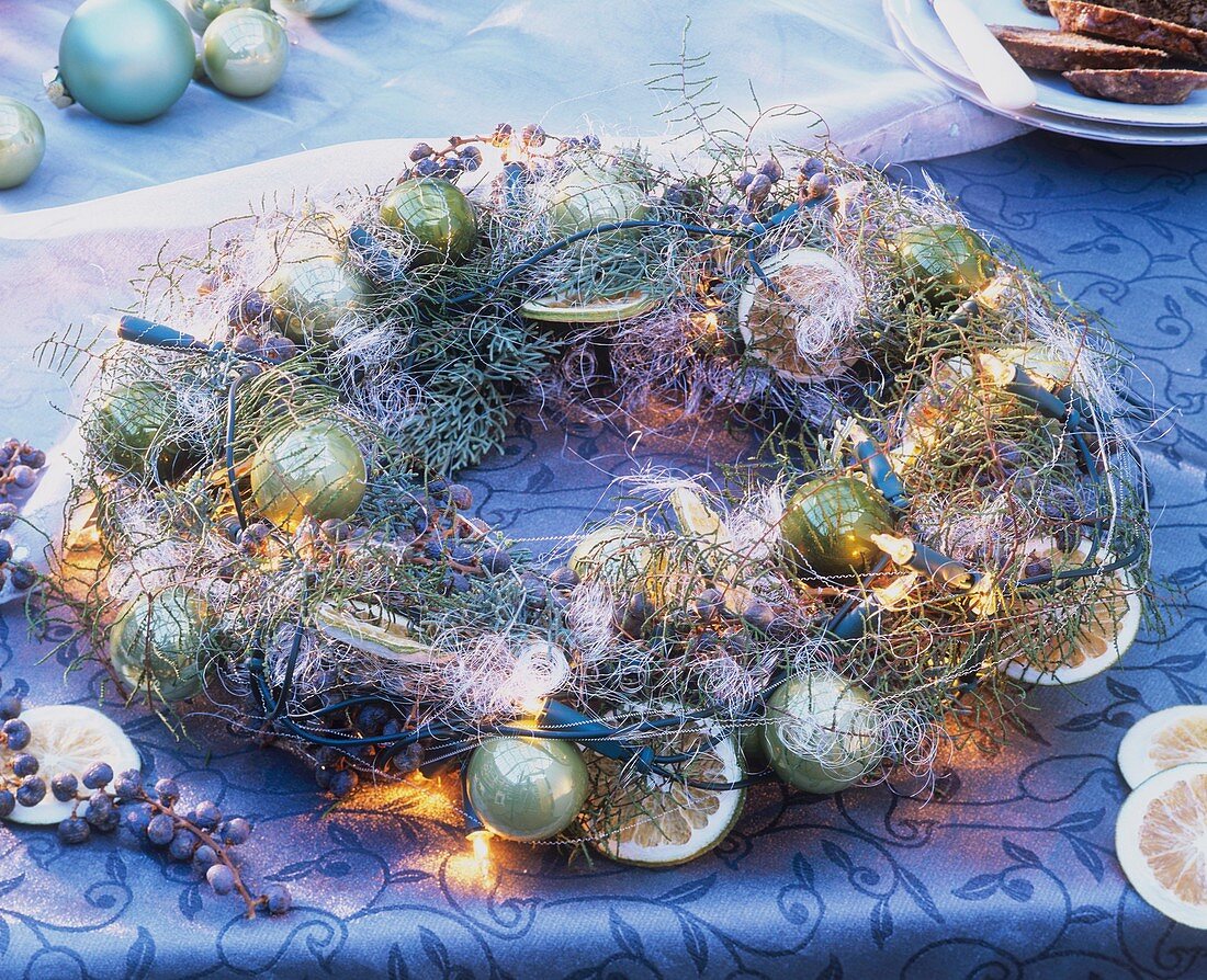 Wreath of cypress, fern, fairy lights & Christmas baubles