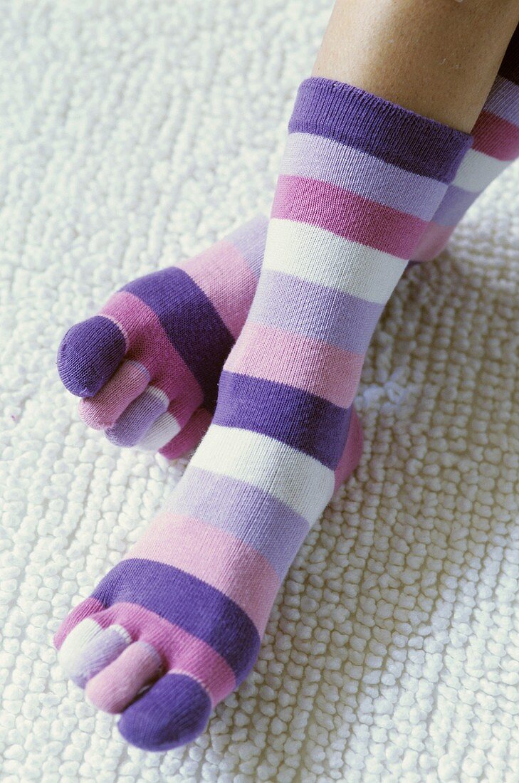 Legs and feet in toe socks