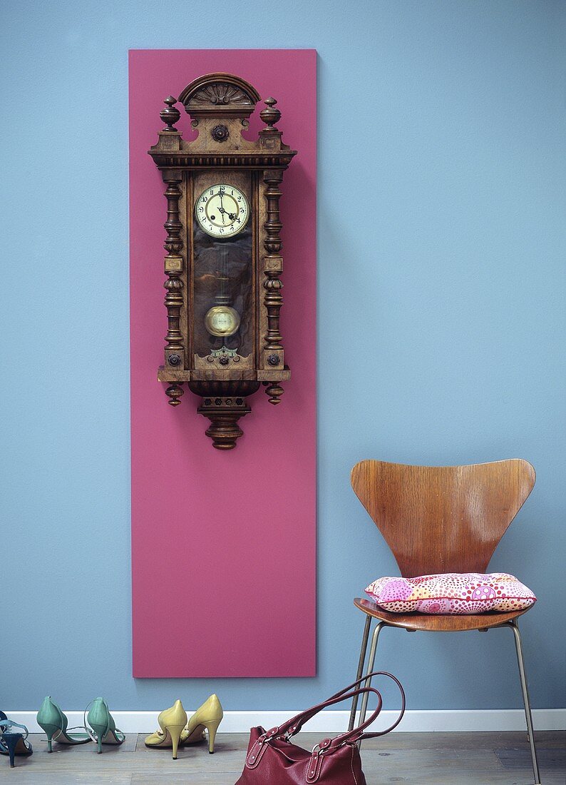 Old wall clock in modern cloakroom