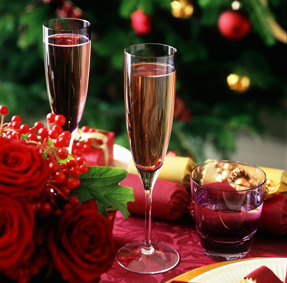 Glasses of champagne on decorated Christmas table