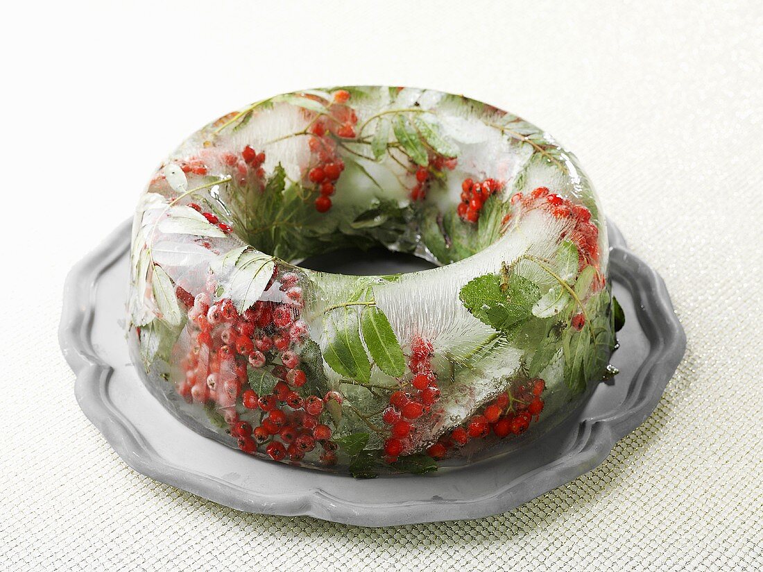 A ring of ice with berries and leaves