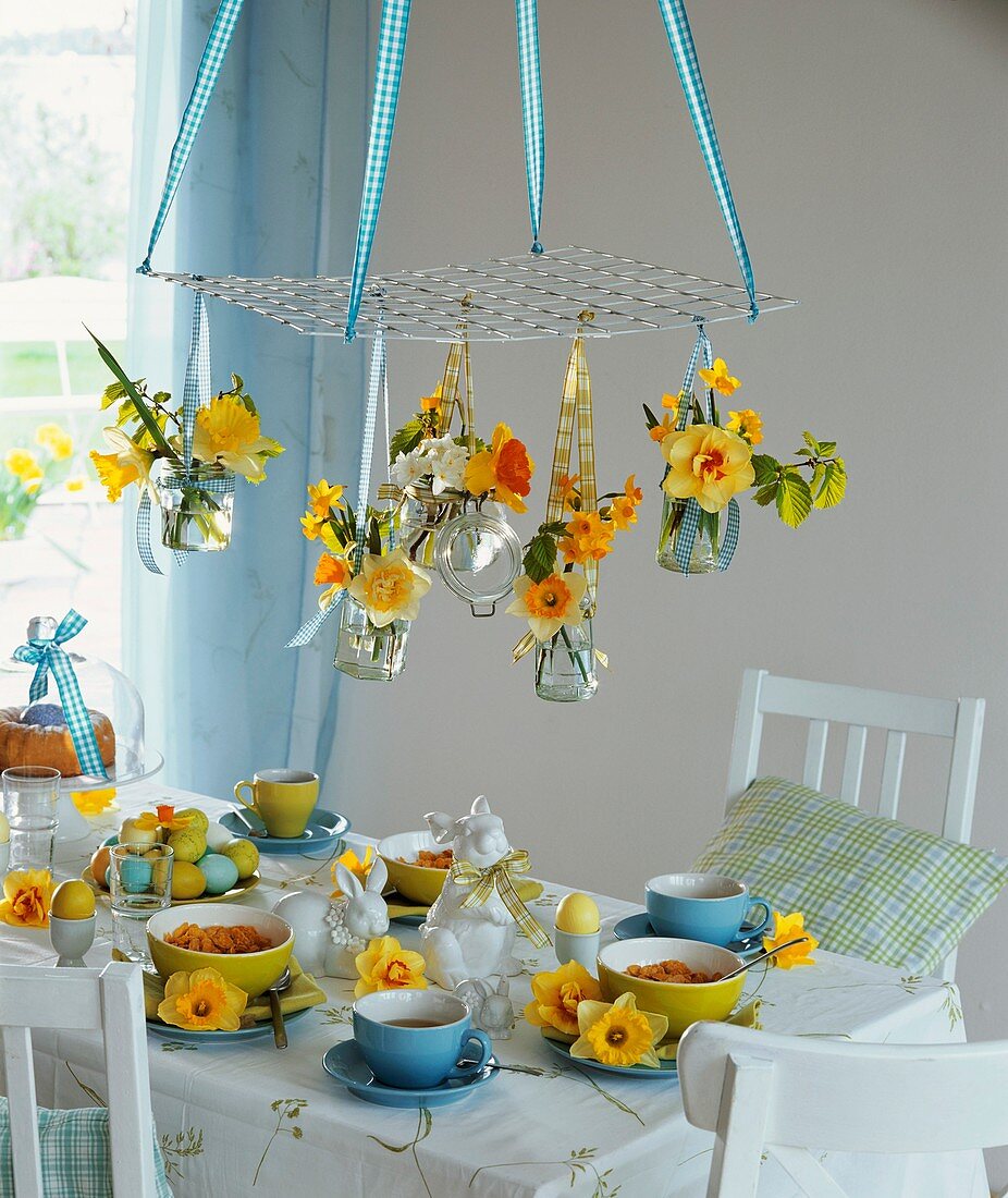 Easter breakfast table decorated with narcissi