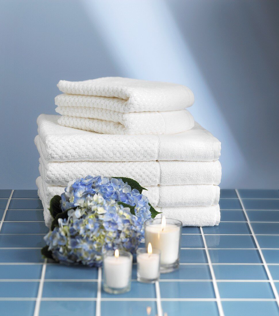 Bath towels, hydrangea flower and candles