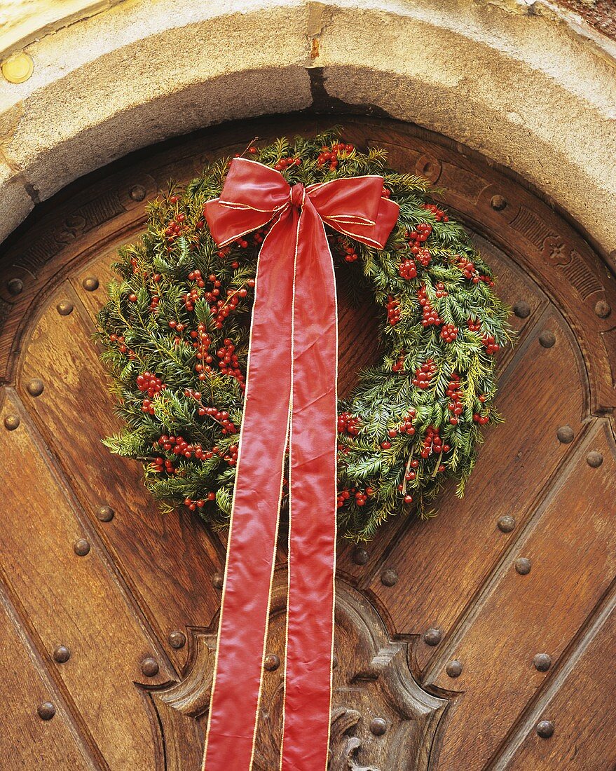Christmas door wreath with holly berries