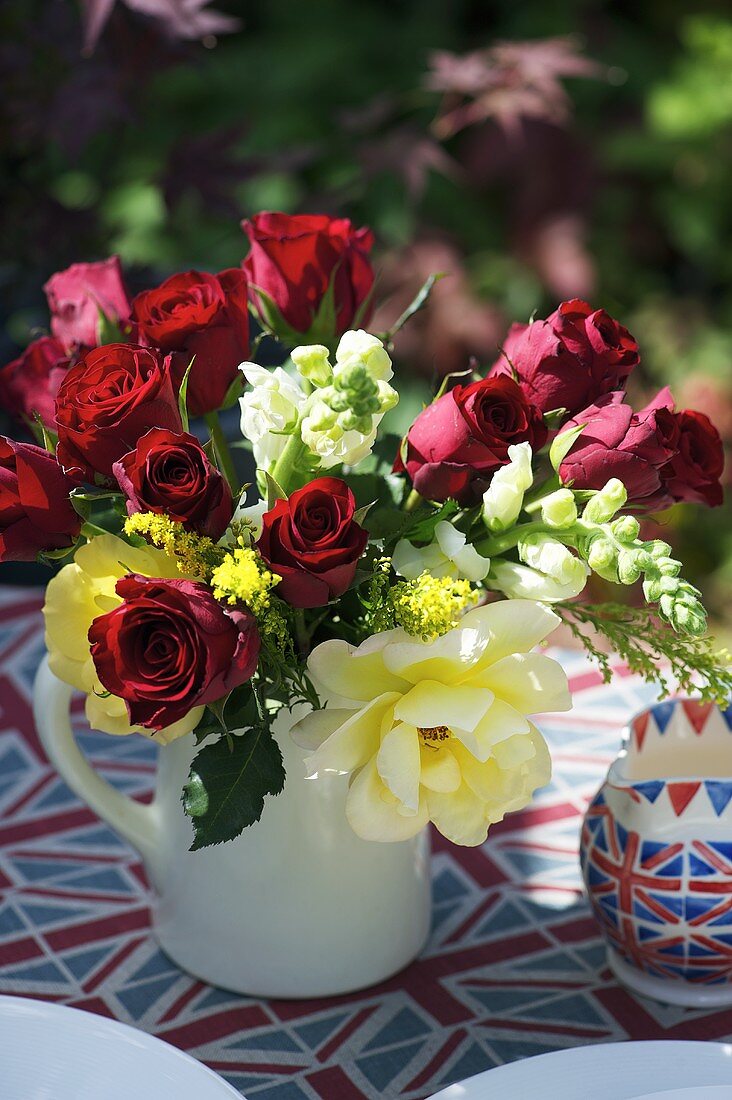 A bunch of roses on a patriotically British table
