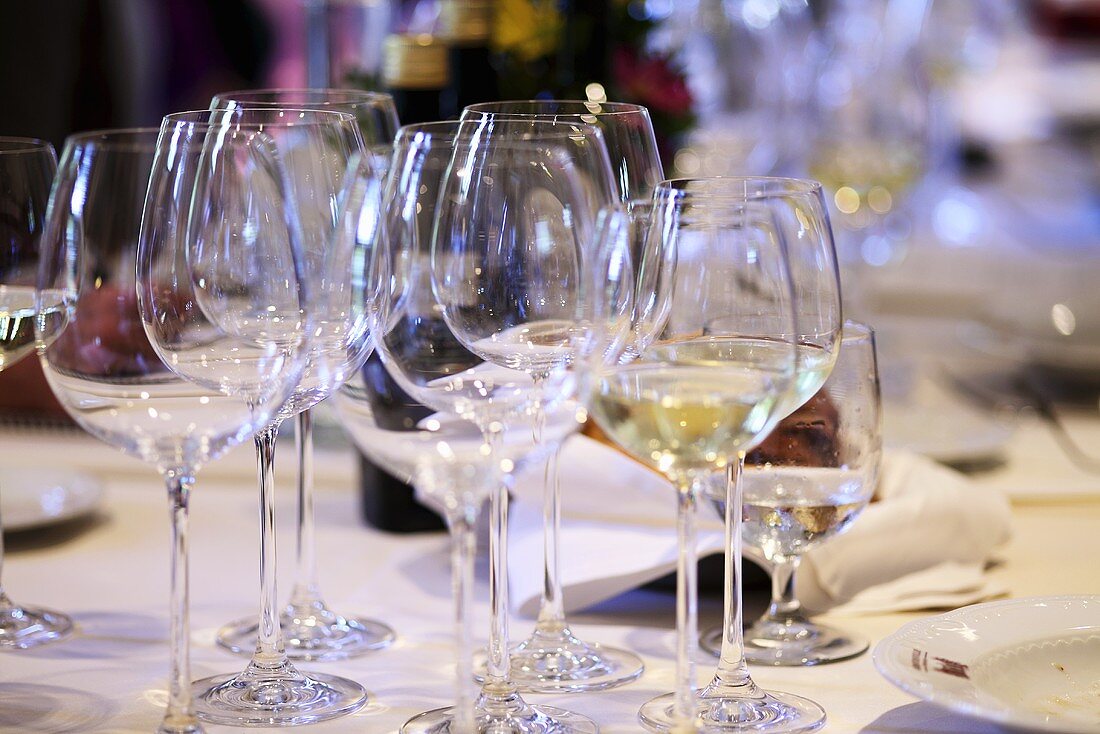 Various wine glasses on a laid table