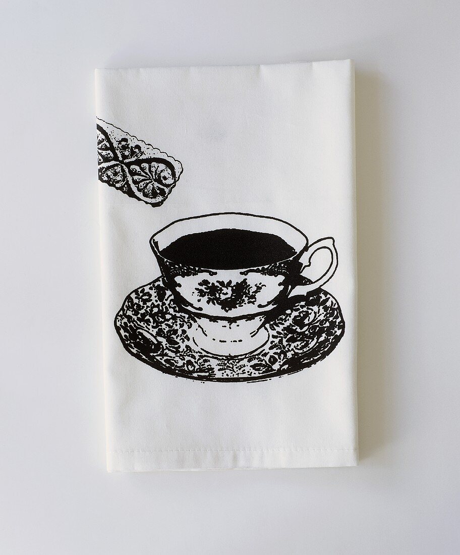 weiße Papierserviette mit aufgedruckter Teetasse & Keks
