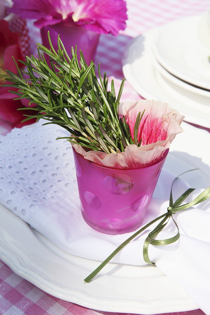 Summery table decoration with rosemary and flowers