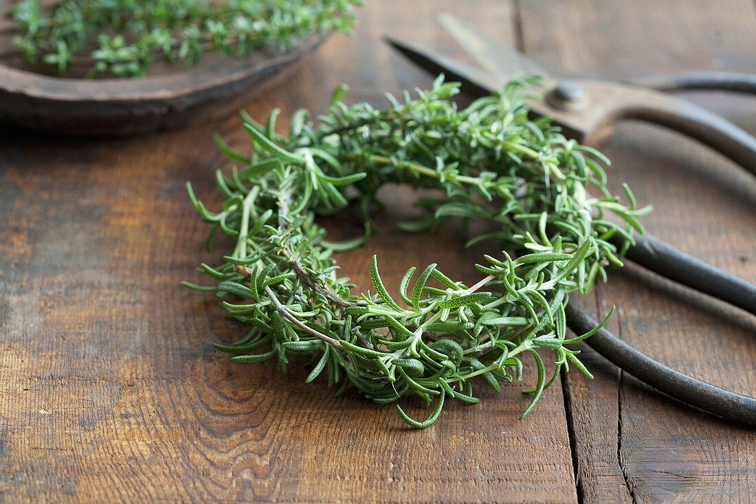 A rosemary wreath and a pair of scissors