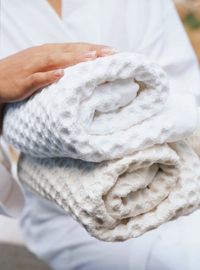 Woman holding towels