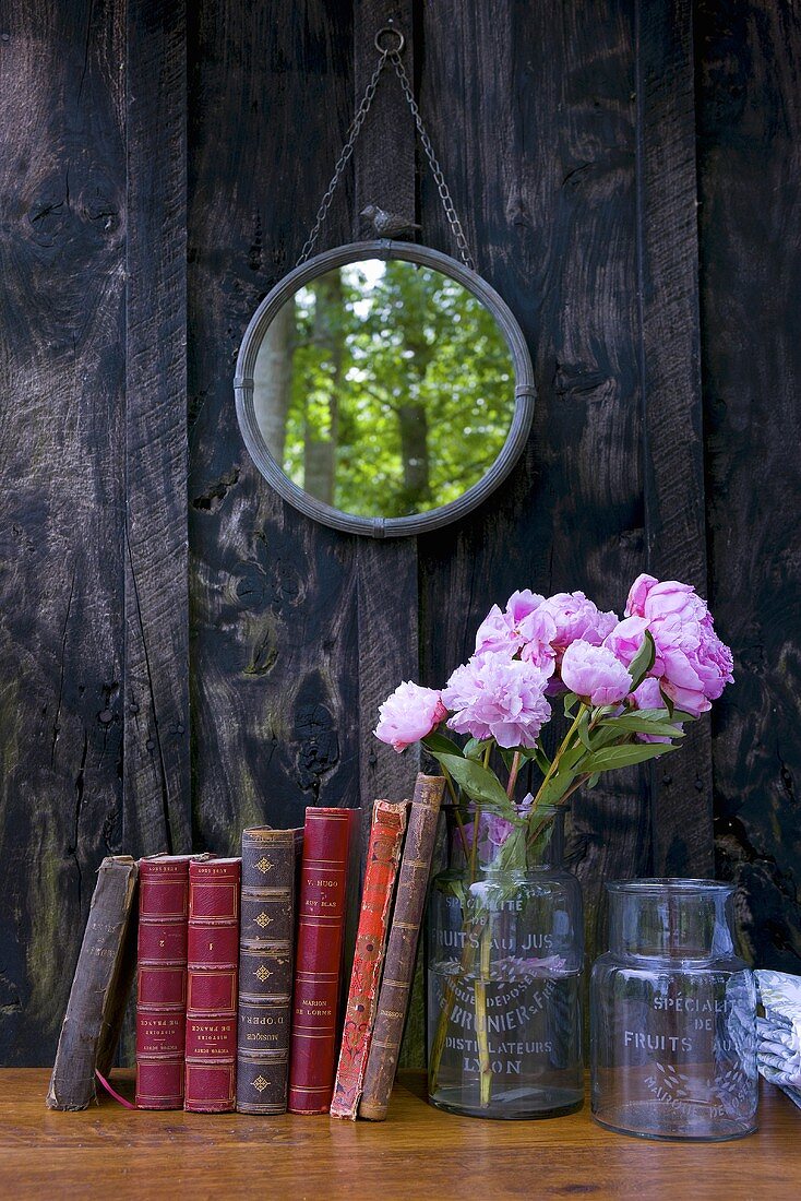 Books, peonies and mirror