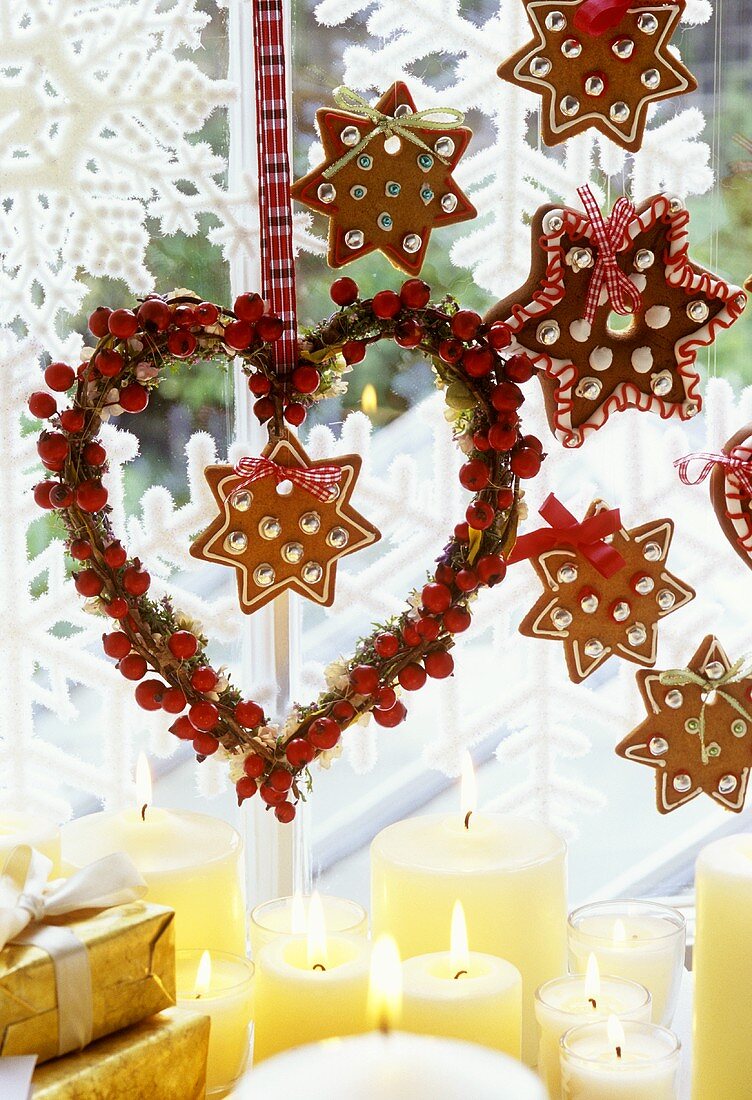 Heart-shaped wreath hanging at a window (Christmas)