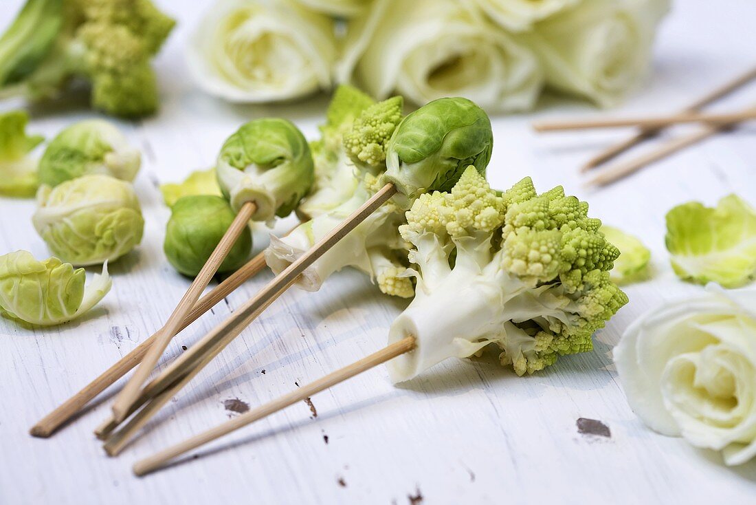 Romanesco florets and Brussels sprouts on wooden skewers