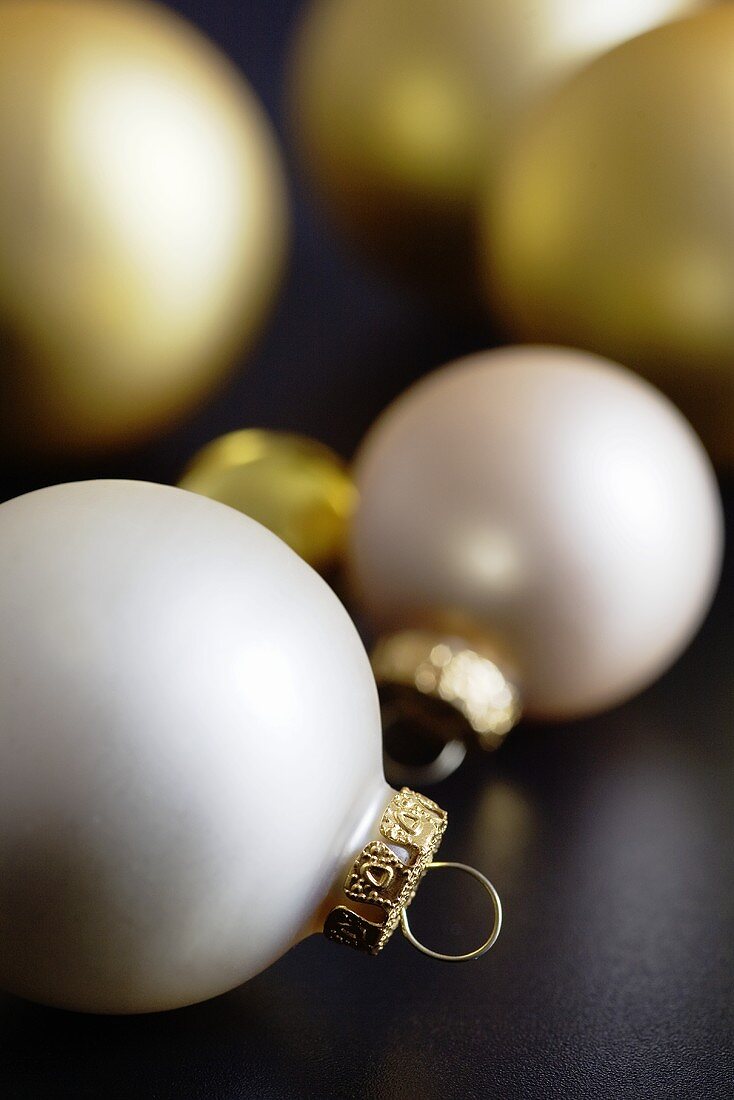 Ivory coloured and golden Christmas baubles