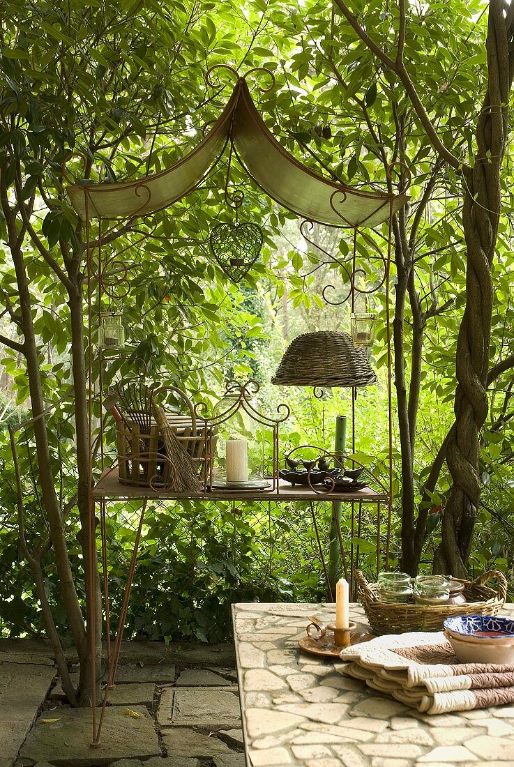 Country style terrace with shelves out of metal and garden