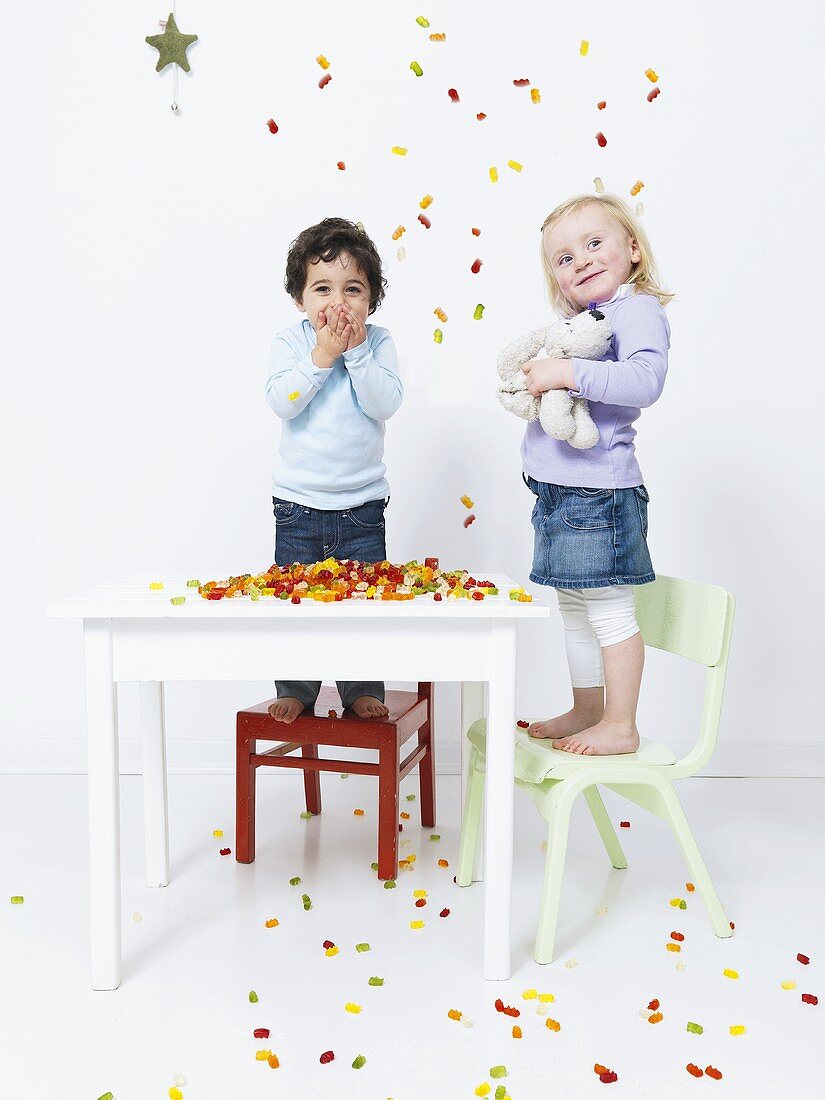 Children with colorful gummy bears