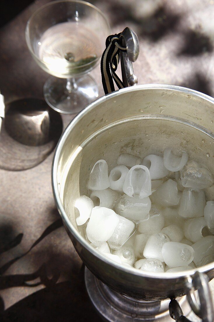 Ice cubes in an ice bucket, wine glass