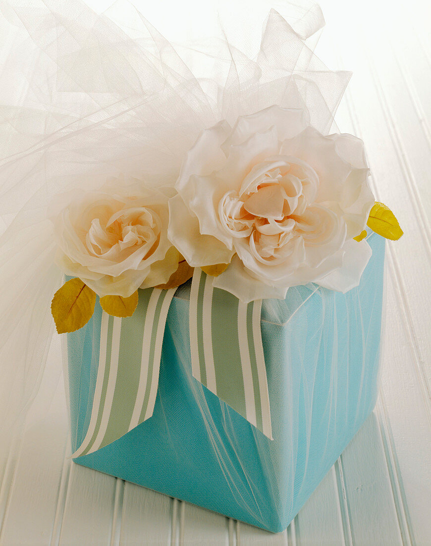 A Bridal Gift Wrapped in Blue Paper with Roses