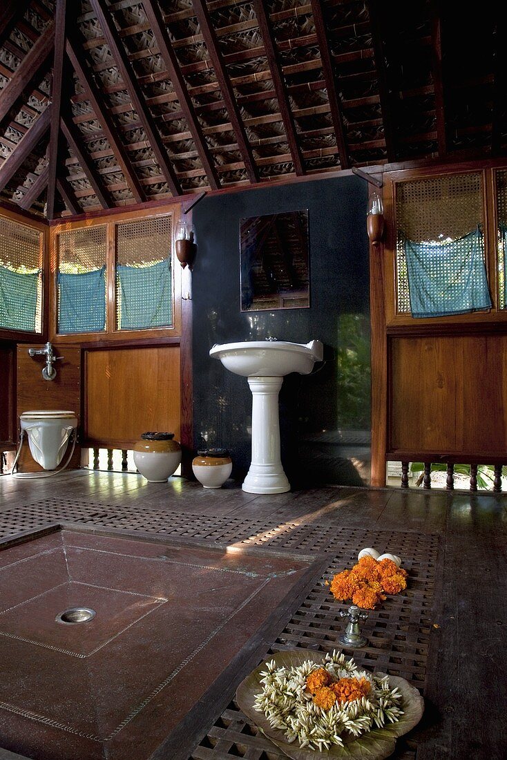 A bathroom in an Indian wooden hut