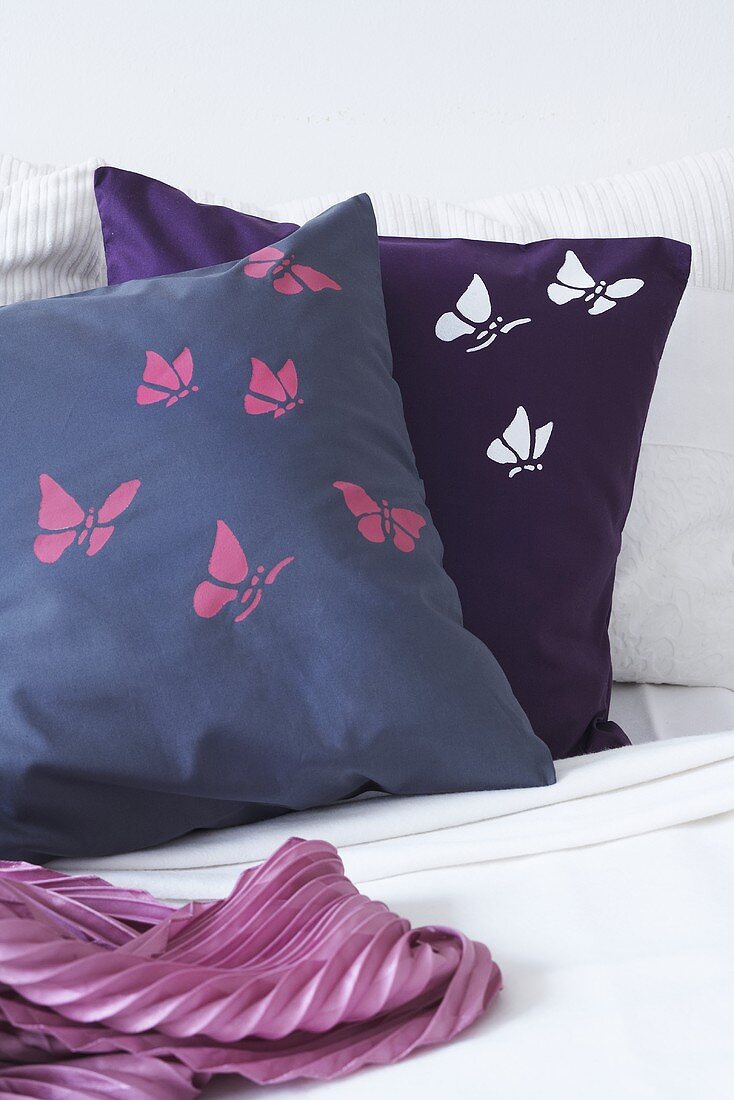 Cushions decorated with butterfly motifs