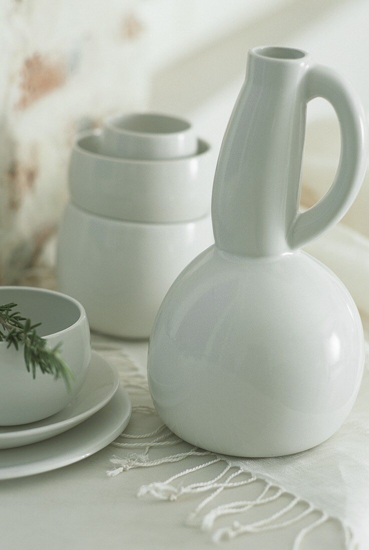 A white carafe and bowls